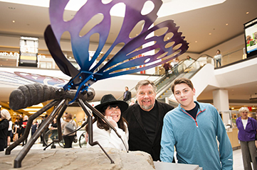 Laurie Triefeldt, Rein, and Gary Ayala with Solar Butterfly at the opening Quaker Bridge Mall in Lawrenceville, N.J.